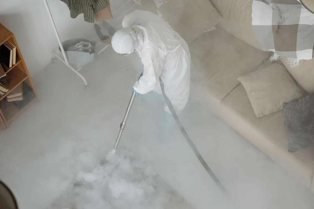 Biohazard cleanup technician in protective equipment, New Prague, MN